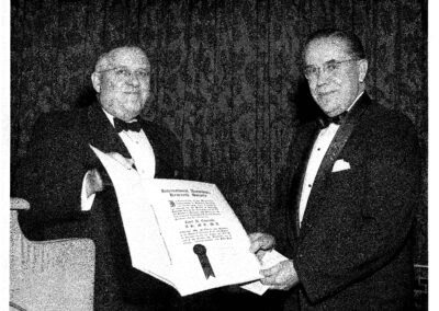 Dr. Cyril Courville was presented with a certificate in 1954