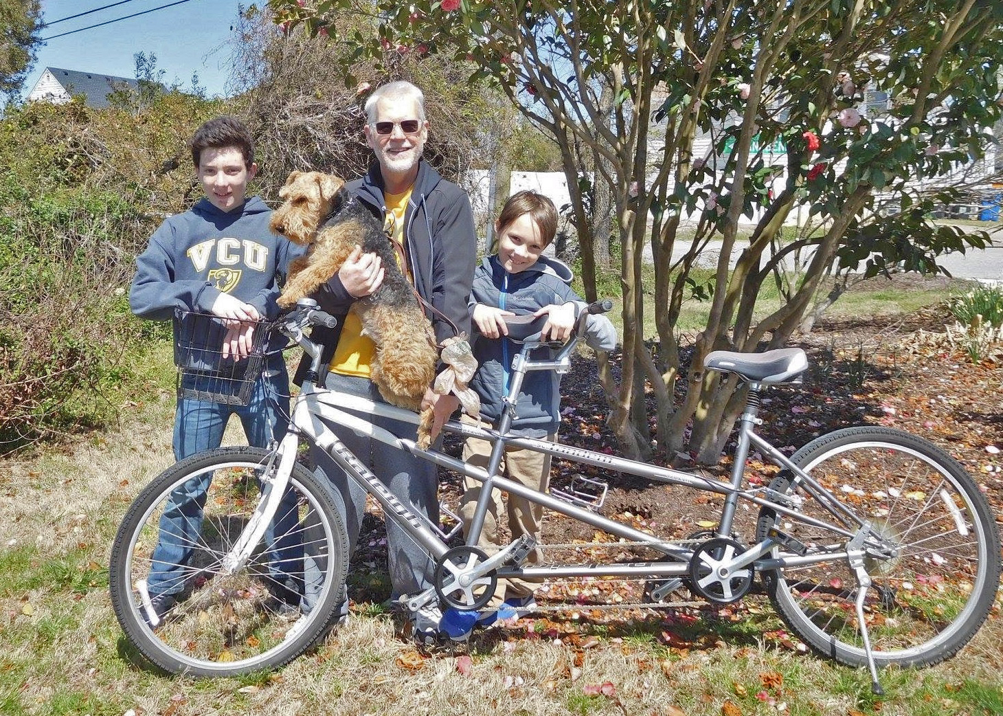 Dr. Butterworth with his grandchildren and one of his dogs